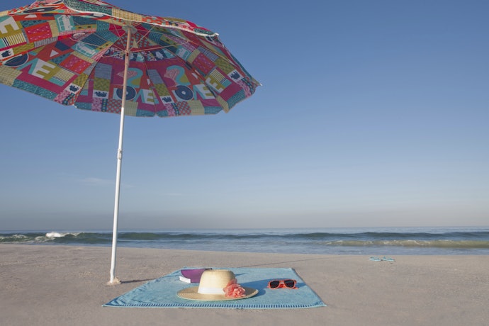 Choose a Weighted Beach Blanket, or One With Pegs and Hoops to Keep It Anchored to the Ground