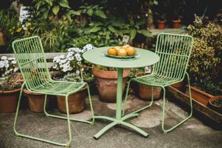 Go For Materials Like Metal, Rattan and Glass as They Do Well Outside, or Wood as Long as It’s Been Treated