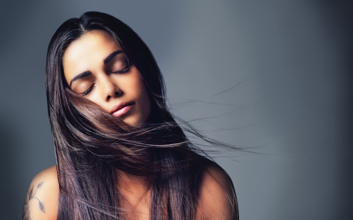 Opt for a Serum With Silicone to Improve Smoothness and Shine and Protect Your Hair From Damage
