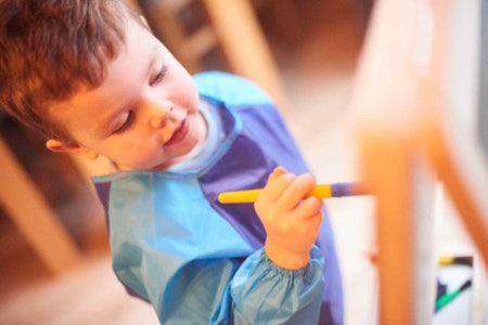 Consider Which Art Medium Your Child Prefers: Paper Dispensers Offer Unlimited Creativity, Whiteboards Can Be Wiped Clean