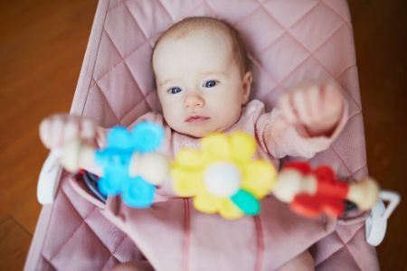 Keep an Eye Out for Entertainment and Developmental Features Like Toy Bars and Music