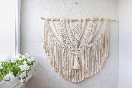 Cotton Wall Hangings Are Great for Bedrooms With Natural Wood Furniture, While Metal Hangings Fit Best With Modern, Industrial Design