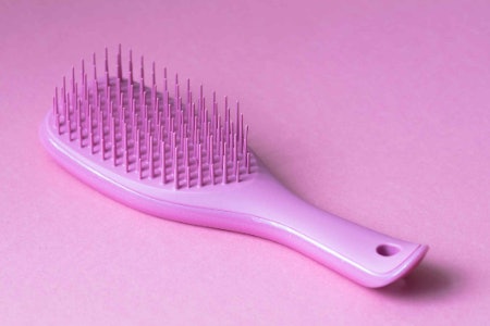 Opt For a Travel Sized Brush for Detangling Your Hair After the Gym or On the Go