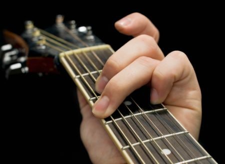 Select Guitars With Low-Mid String Action As They'll Be Easier to Press Down on When Learning