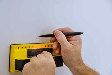 Choose an Electronic Cable Finder to Detect Live Wires or a Magnetic Stud Finder for Locating Nails
