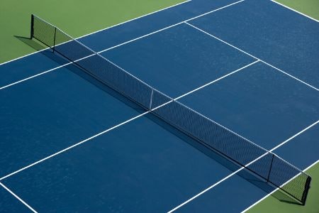 Hard and Artificial Grass Courts Require Heavier-Duty Balls
