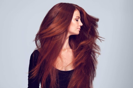 Opt For a Barrel Brush for Volume and Waves, or a Flat Brush for Hair Straightening