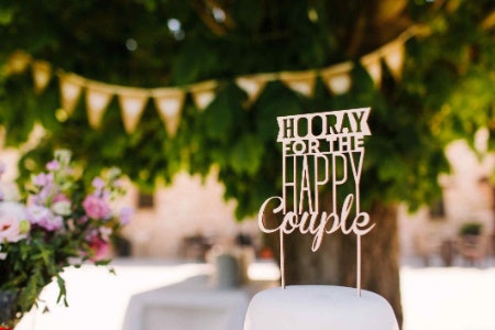 Opt For a Resin Topper for Traditional 3D Figures, and Wood or Acrylic for Silhouettes and Calligraphy