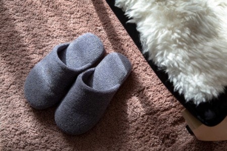 Mules, Open Toes and Boots Are Perfect for Relaxing While Full Slippers Are Better for Moving Around In